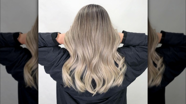 Woman models platinum balayage