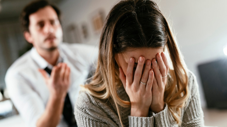 man and woman in a fight
