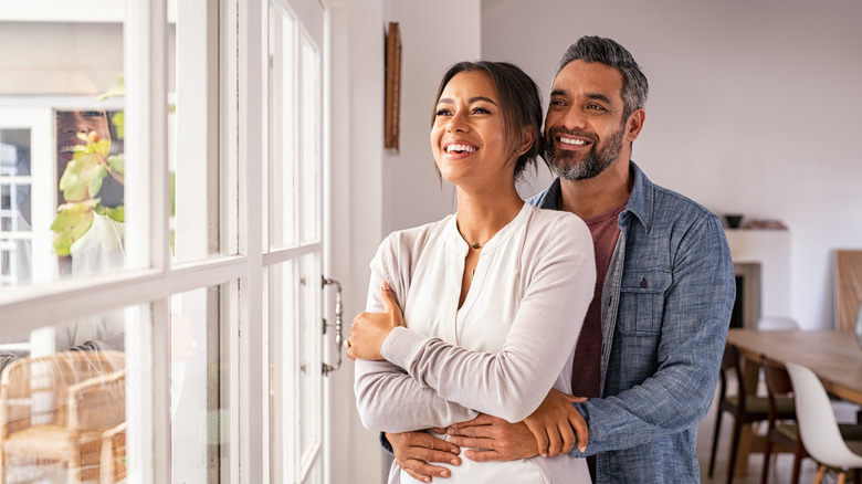 Couple happy at the window