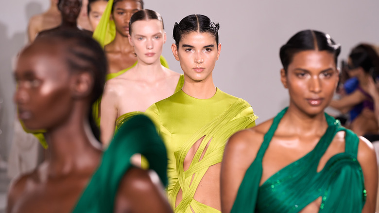 models walking down a runway