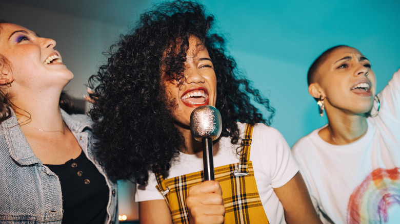 Women singing karaoke