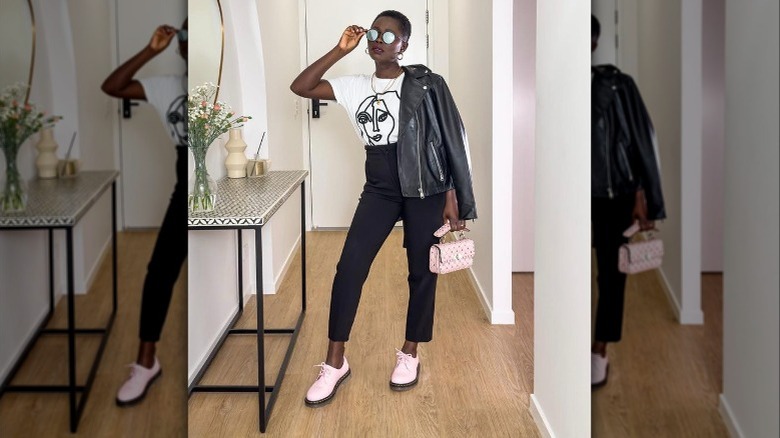 A woman wearing a leather jacket