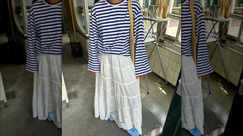 woman wearing tiered white skirt and mariniere top