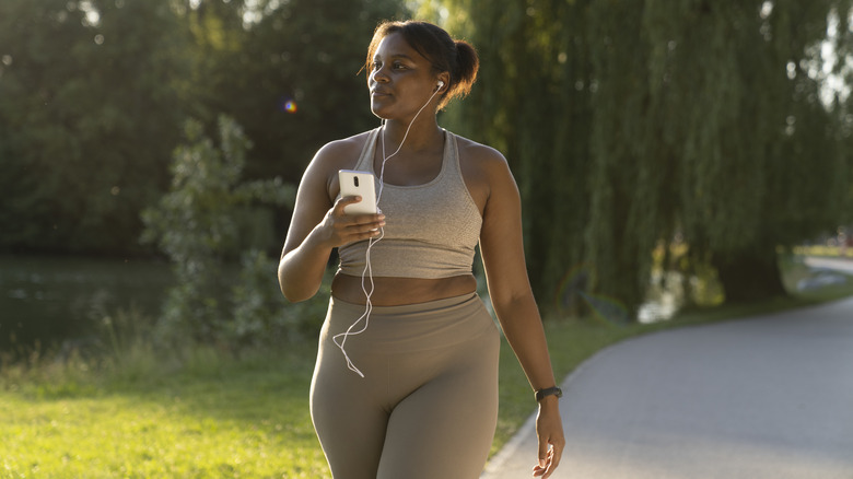 Woman on a walk with phone