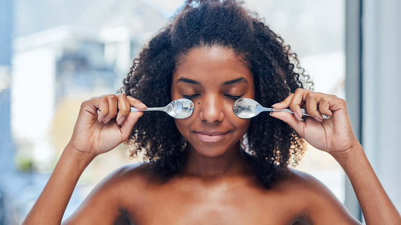 Woman massaging her face