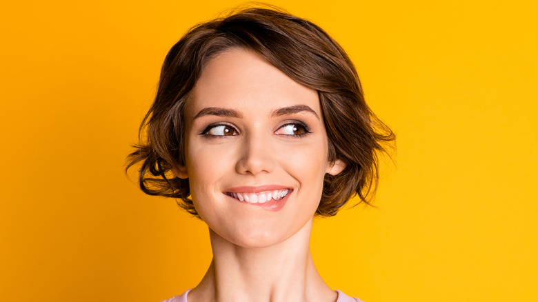 woman biting lower lip