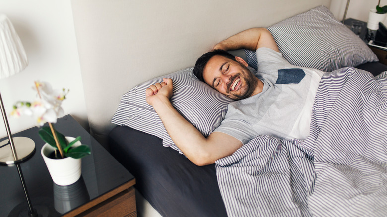 man laying on back smiling
