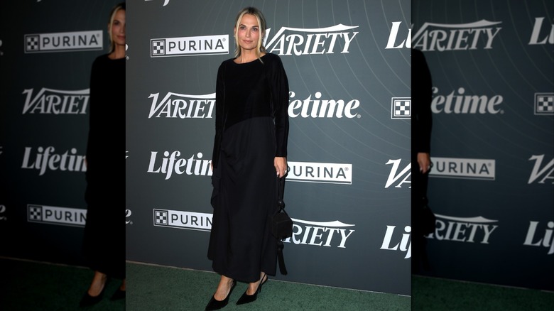 Molly Sims wearing a black dress