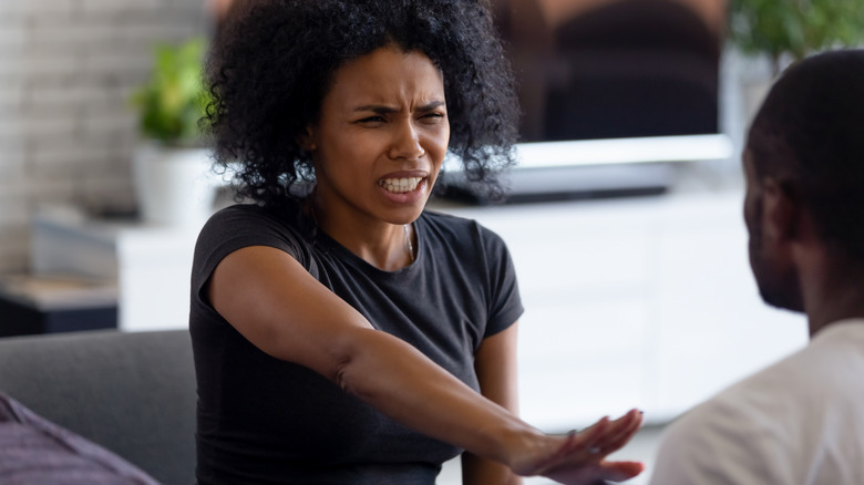 Unhappy couple sitting on bench