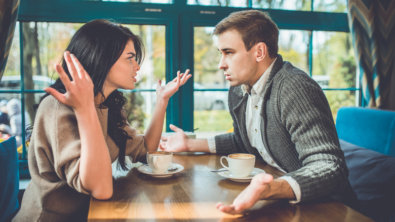 Couple arguing at restaurant