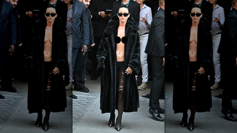 Katy Perry walking topless with a fur coat