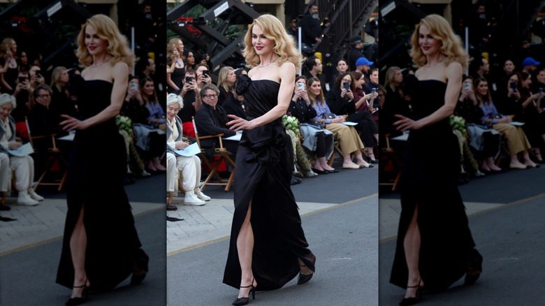 Nicole Kidman strutting in a black strapless gown