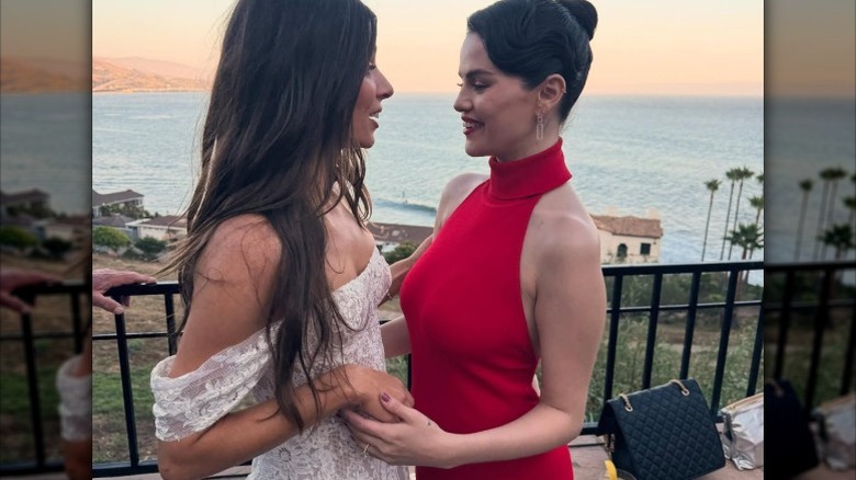 Selena Gomez chats with the bride at a wedding reception
