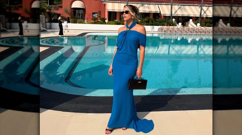 Sofia Richie Grainge poses at a friend's wedding in a blue dress