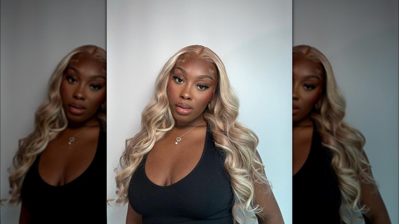 Woman with blond hair and black top