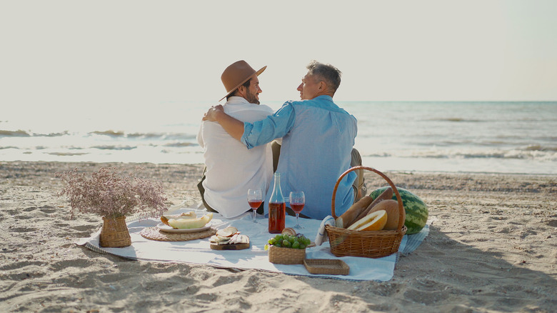 couple cuddling on a beach
