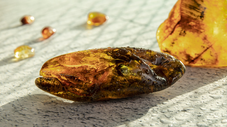 Amber stones on sand 