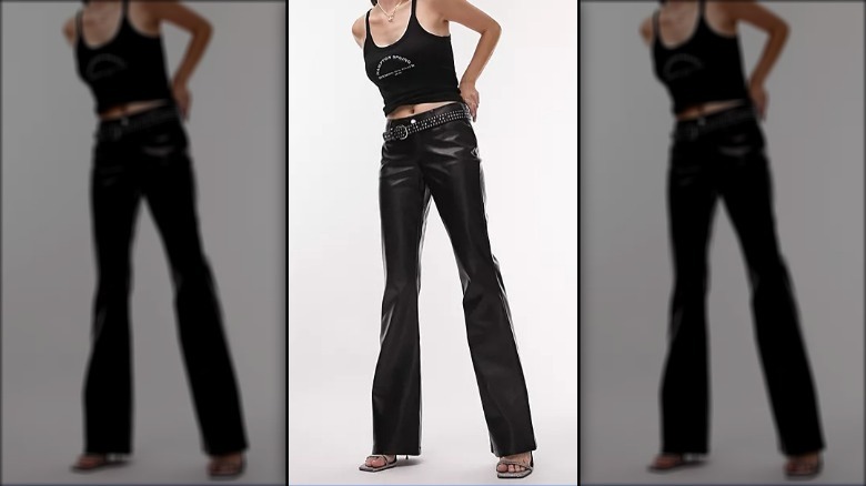 Model wearing flared leather pants