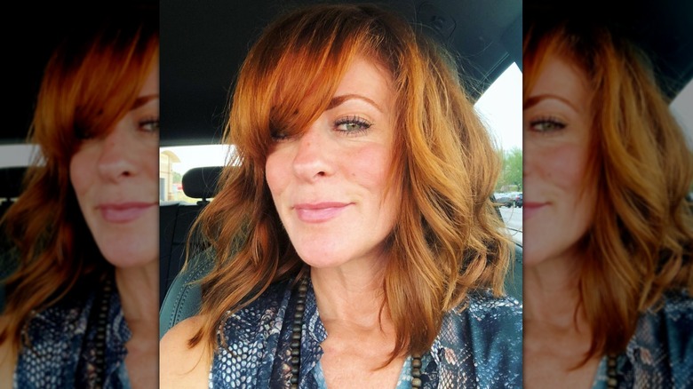 woman smiling in car