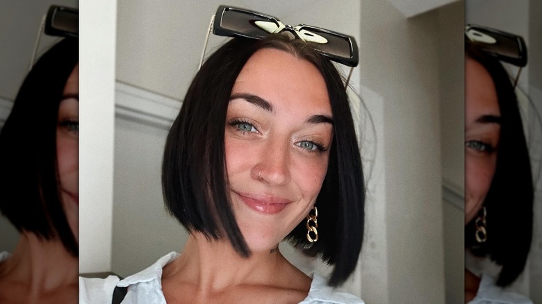 woman with bob and earrings