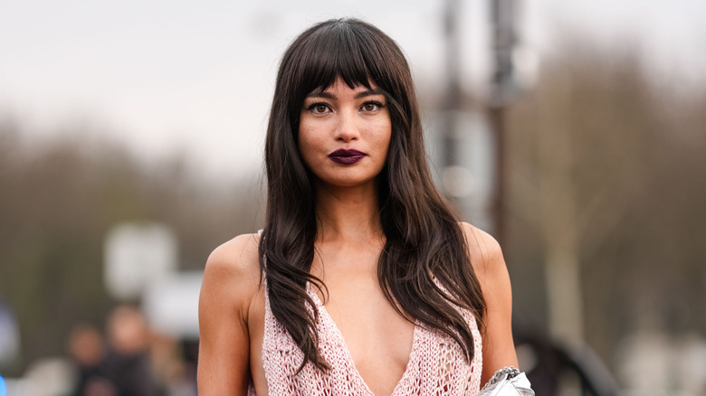 Woman with bangs and long brown hair