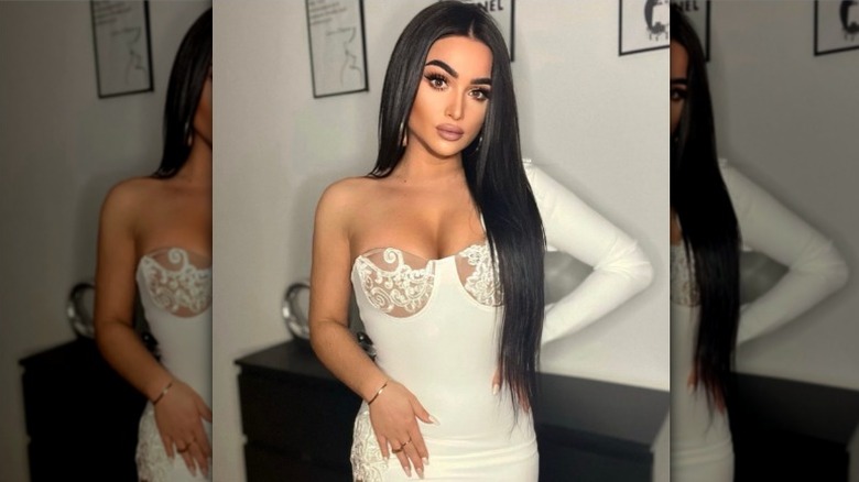 Woman with white dress and full makeup