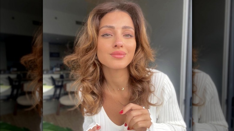 Woman in white dress and soft makeup