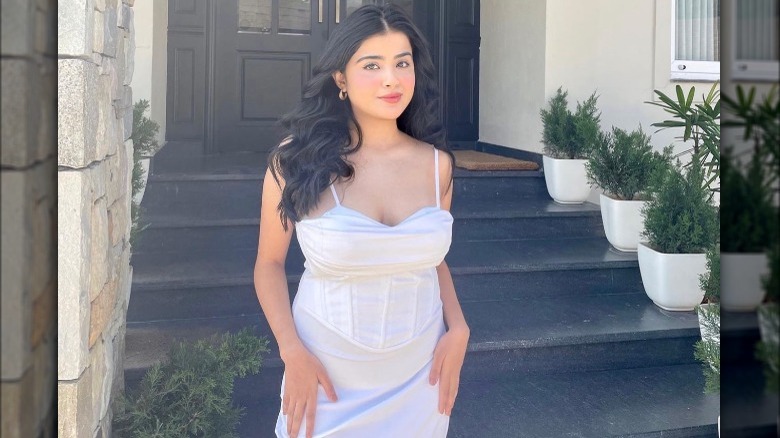 Woman with white dress and pink makeup