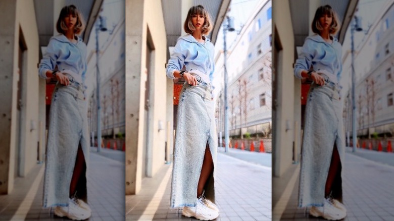 Long denim skirt with white sneakers