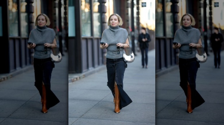 woman wearing long denim skirt with boots