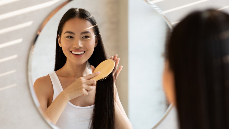 A woman brushing her hair