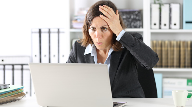 Shocked woman laptop