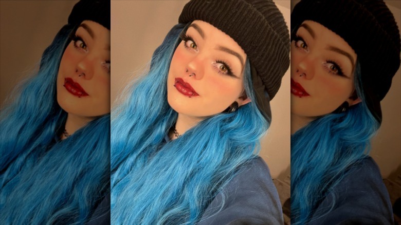 Bold red lipstick with piercings