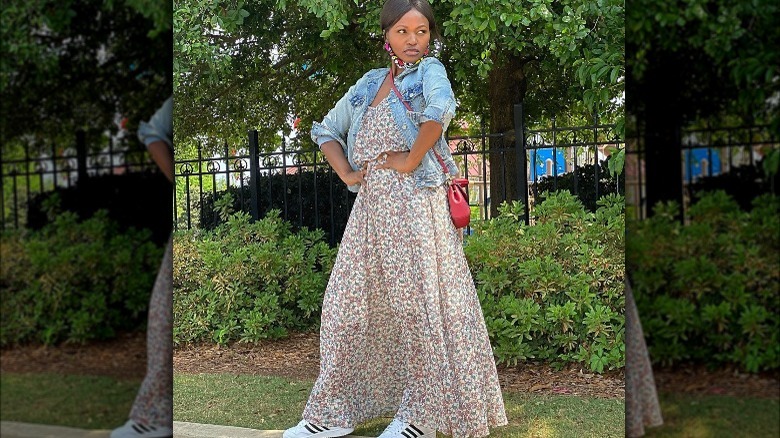 Person wearing floral dress and jean jacket