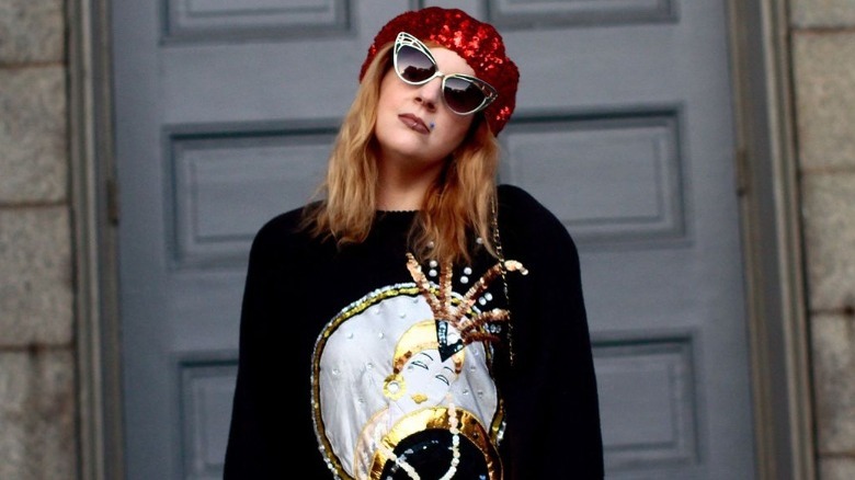 Punk woman in black clothes and metal sunglasses