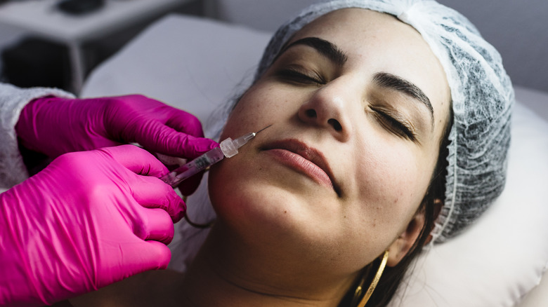 woman getting facial injectables