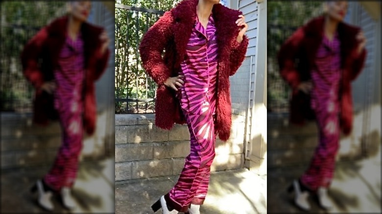 Woman wearing pajamas and coat