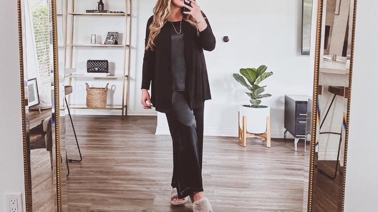 Woman wearing layers and pajamas