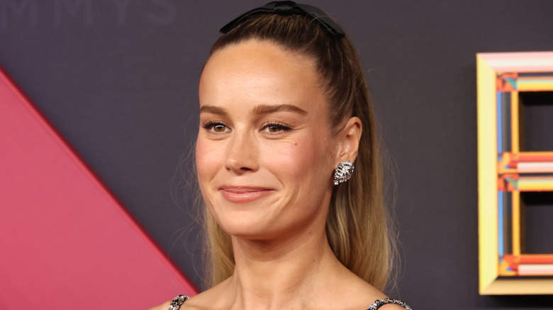 Brie Larson with her long hair in a ponytail