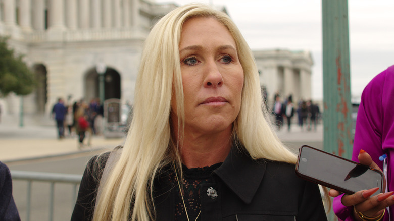 Majorie Taylor Greene, who is in a relationship with Brian Gleen, looking displeased