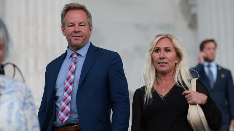Marjorie Taylor Greene and Brian Glenn standing beside each other amid the red flag speculations