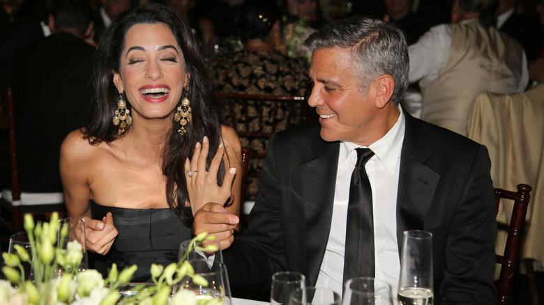 George Clooney (R) and fiance Amal Alamuddin attend the Celebrity Fight Night gala celebrating Celebrity Fight Night In Italy benefitting The Andrea Bocelli Foundation and The Muhammad Ali Parkinson Center on September 7, 2014 in Florence, Italy (2014)