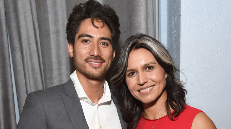 Tulsi Gabbard and her husband Abraham Williams posing for a photo at the Sean Penn CORE Gala