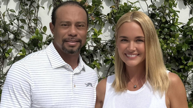 Tiger Woods and Vanessa Trump posing for a photo.