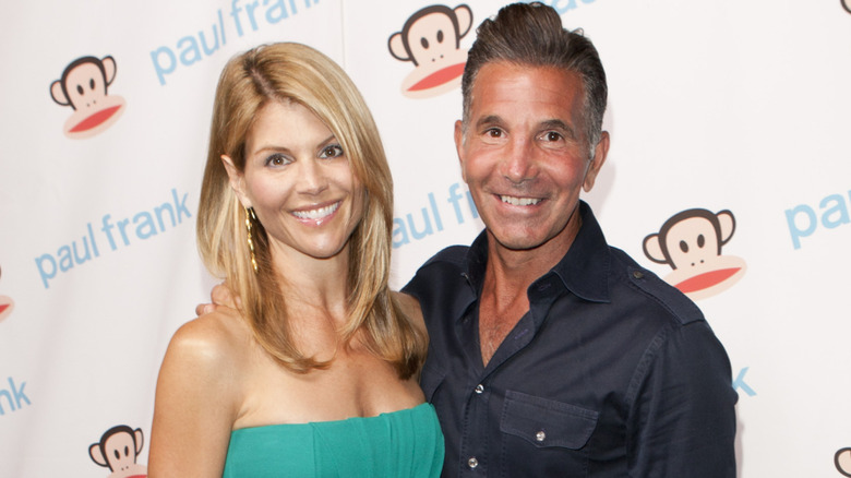 Lori Loughlin and Mossimo Giannulli smile together in happier times