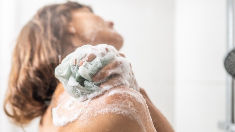 A woman washes in the shower