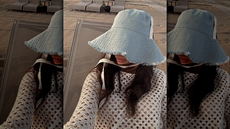 woman wearing wide brim denim bucket hat