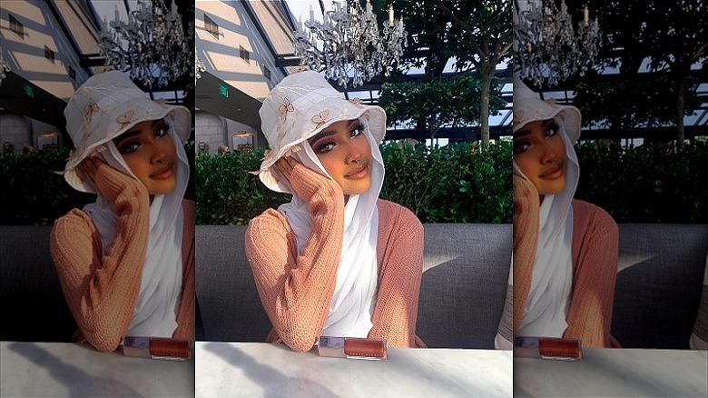 woman wearing bucket hat over hijab