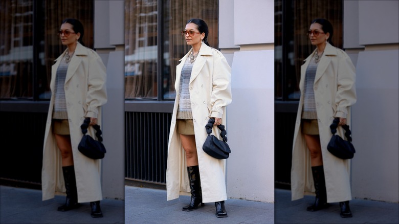 woman wearing light trenchcoat