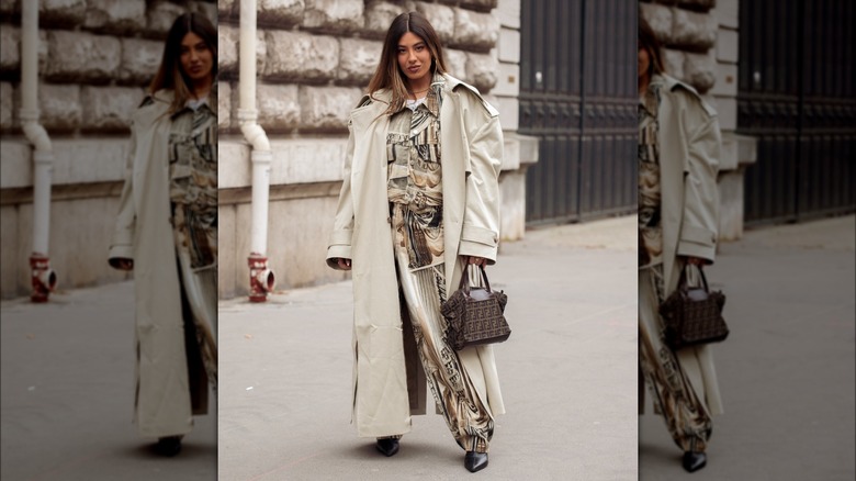 woman wearing oversized trenchcoat